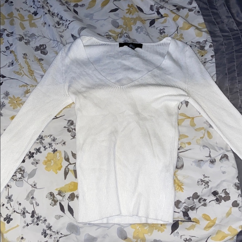 A long sleeve white cardigan.